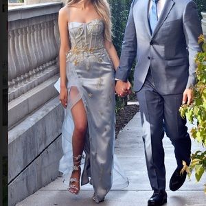 Light blue bustier gown with gold beaded details and tulle side skirt